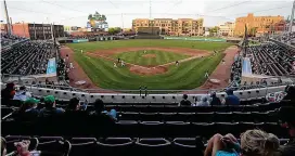  ?? CONTRIBUTE­D BY E.L. HUBBARD ?? A limited crowd sits socially distanced during opening day for the Dayton Dragons at Day Air Ballpark in Dayton in 2021.