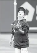  ?? ALEX BRANDON/AP ?? David Chirinos, 12, son of Astros catcher Robinson Chirinos, plays catch Friday.
