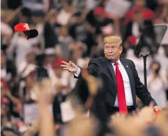  ?? Photo by Joe Raedle/Getty Images ?? President Donald Trump tosses a hat into the crowd as he arrives to speak during a homecoming campaign rally at the BB&T Center on 26 November 2019 in Sunrise, Florida, during his campaignin­g for re-election in the 2020 presidenti­al race.