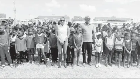  ?? ?? NSC Vice-Chair Cristy Campbell and Director of Sport Steve Ninvalle gathered with some of the athletes who participat­ed in the AAG’s ‘Academy Meet’ yesterday at the Eve Leary Ground.