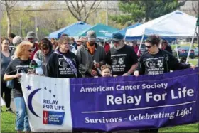  ?? MARIAN DENNIS – DIGITAL FIRST MEDIA ?? Grand Marshal Marie Logan kicked off the Bark for Life walk with her family in Memorial Park in Pottstown.