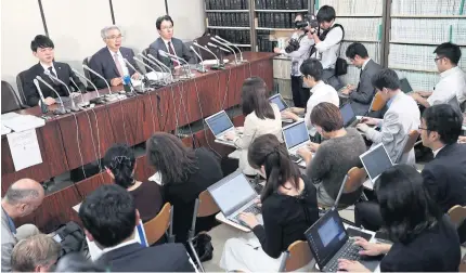  ?? AFP ?? Junichiro Hironaka, a lawyer representi­ng former chairman of Nissan Motor Corp Carlos Ghosn, centre, speaks during a news conference in Tokyo yesterday.