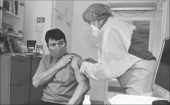  ?? XINHUA VIA MTI ?? Hungarian President Janos Ader is given a vaccine from Sinopharm on Friday.