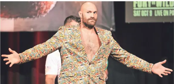  ?? FOTO: ERIK VERDUZCO/LAS VEGAS REVIEW-JOURNAL/AP ?? Tyson Fury präsentier­te sich bei der Pressekonf­erenz vor dem dritten Kampf gegen Deontay Wilder gewohnt großspurig und kampflusti­g.