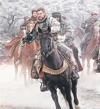  ??  ?? Territory lad Chris Hemsworth in a scene from the movie 12 Strong