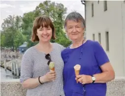  ?? EMMA YARDLEY ?? Emma Yardley and her mother, Susan, stop for an ice cream cone on the medieval bridge of Regensburg after a day of exploring and Birkenstoc­k shopping.