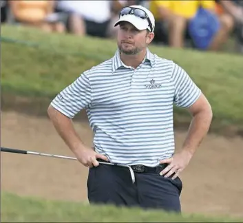  ?? Frank Gunn/The Canadian Press ?? Steve Wheatcroft looks on in frustratio­n after hitting his ball into the water on the 18th hole Sunday in the final round of the Canadian Open golf tournament in Oakville, Ontario. Wheatcroft, an Indiana, Pa., native, was within one shot of the lead...