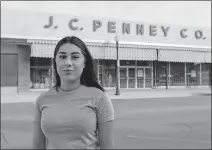  ??  ?? In this Dec. 6 photo, Alexandra Orozco stands for a portrait outside of the closed J.C. Penney where she was laid off from, in Delano, Calif. [MADELINE TOLLE/ THE FULLER PROJECT VIA THE ASSOCIATED PRESS]