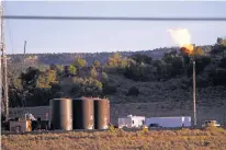  ?? LUIS SÁNCHEZ SATURNO/NEW MEXICAN FILE PHOTO ?? An oil and gas wellhead flares in 2014 in the Chaco Canyon area. Officials have voiced concerns about the uptick of drilling in the San Juan Basin and the proximity of wells to Chaco Culture National Historical Park.