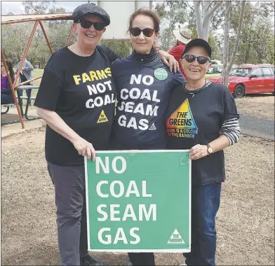  ??  ?? Bizzi Mason, Sally Forsstrom and Kris Stevens – their t-shirts and placard express their concerns about CSG exploratio­n. PHOTO: SUPPLIED