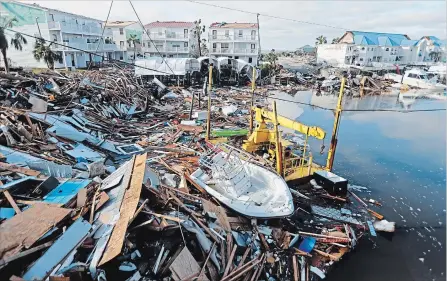  ?? GERALD HERBERT THE ASSOCIATED PRESS ?? Hurricane Michael left some boats tossed ashore like toys in Mexico Beach, Fla., on Thursday.