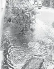  ?? HEATHER GAKER/COURTESY ?? Heather Gaker’s Boynton Beach home after a heavy rainstorm with floodwater puddled near her foundation.