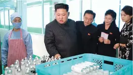  ??  ?? This undated picture released from North Korea’s official Korean Central News Agency (KCNA) on Sunday shows North Korean leader Kim Jong-un inspecting the Pyongyang Cosmetics Factory, as his wife Ri Sol-Ju (R) looks on. — AFP