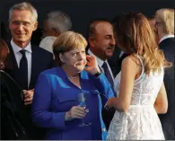  ?? AP/PABLO MARTINEZ MONSIVAIS ?? German Chancellor Angela Merkel chats with first lady Melania Trump at the Parc du Cinquanten­aire in Brussels.