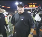  ?? Associated Press ?? UCLA coach Chip Kelly walks off the field following the team’s game against Oregon State on Oct. 14 in Corvallis, Ore. Kelly stepped down as coach of the Bruins on Friday and was hired as the offensive coordinato­r at Ohio State.