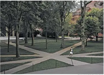 ?? TONY LUONG/THE NEW YORK TIMES ?? The U.S. walked back a policy that would have stripped foreign students of visas if classes were entirely online. Above, a nearly empty Harvard Yard last week at Harvard University.