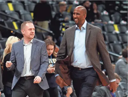  ?? DAVID ZALUBOWSKI/AP ?? The Nuggets will promote Calvin Booth, right, to general manager under president of basketball operations Tim Connelly, left.