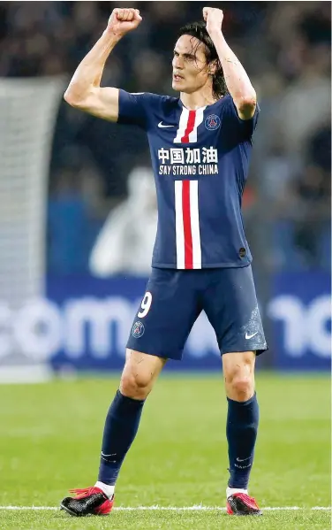  ?? Reuters ?? Paris St Germain’s Edinson Cavani celebrates after scoring a goal against Bordeaux during their French League match on Sunday.