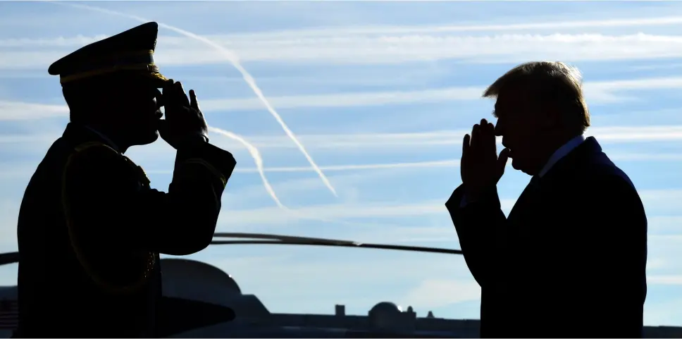  ??  ?? HAIL TO THE CHIEF: President Donald Trump is greeted with a salute as he walks down the steps of Air Force One at John F. Kennedy Internatio­nal Airport in New York on his return to his home city yesterday to attend a series of fundraiser­s