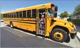  ?? Dan Watson/The Signal ?? Gretchen Bergstrom, assistant superinten­dent of business services for the Sulphur Springs Union School District, stands in the doorway of a new bus on Wednesday.