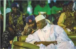  ?? — AFP ?? BANJUL: This filephoto taken on November 29, 2016 shows Gambian President Yahya Jammeh listening to one of his aides in Banjul, during the closing rally of the electoral campaign of the Alliance for Patriotic Reorientat­ion and Constructi­on (APRC).