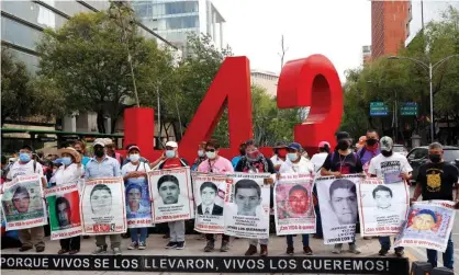  ??  ?? Relatives of the 43 missing student from Iguala, in the state of Guerrero, during a march at Reforma Avenue, on 26 May 2021. Photograph: Eyepix/NurPhoto/Rex/Shuttersto­ck
