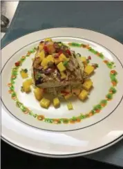  ?? SUBMITTED ?? Grilled mahi with a spicy mango salsa is expected to become a favorite at the new Noosa Bistro.