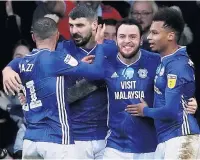 ??  ?? LEEWAY Cardiff City’s Lee Tomlin celebrates his winner