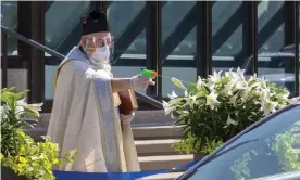  ?? Photograph: Jim West/Zuma Wire/Rex/Shuttersto­ck ?? Timothy Pelc conducts the traditiona­l Blessing of the Easter Baskets at St Ambrose Catholic church in April.