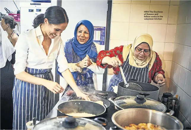  ?? IMAGES: JENNY ZARINS ?? HRH The Duchess of Sussex and fellow cooks in the volunteer kitchen