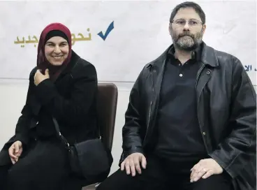  ?? OMAR HAJ KADOUR / AFP / GETTY IMAGES ?? Jolly Bimbachi, left, and Sean Moore, who were being held by a jihadist-dominated alliance in northwest Syria, speak with media on Monday after they were released from “polite” captivity to Turkish authoritie­s.