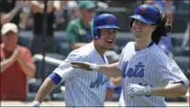  ?? KATHY WILLENS — THE ASSOCIATED PRESS ?? New York Mets on-deck batter Michael Conforto, left, Mets starting pitcher Jacob deGrom who hit a home run during the third inning of a baseball game against the Washington Nationals, Sunday in New York. The Mets prevented a sweep by the Nationals by...