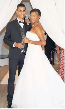  ?? CONTRIBUTE­D PHOTOS ?? Bride and groom, if only for a few hours. Models Kadron Henry and Shaneel Thomas, both members of staff at Melia Braco, got high marks for playing their part in highlighti­ng the hotel's bridal suite that was unveiled in the Second City last Saturday.