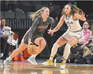  ?? Ethan Miller/Getty Images ?? Washington State’s Johanna Teder and UCLA’s Kiki Rice in the first half of the championsh­ip game of the Pac-12 Conference women’s basketball tournament on March 05 in Las Vegas.