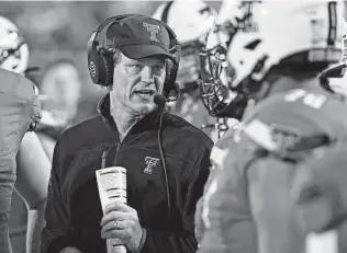  ?? Brad Tollefson / Associated Press ?? Texas Tech interim coach Sonny Cumbie, left, played for and later was an assistant coach at Texas Tech under Mike Leach, now the Mississipp­pi State head coach. The two meet again on Tuesday.