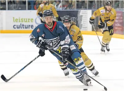  ?? Picture: Derek Black. ?? Stars’ Anthony Mastrodica­sa comes under pressure from Nottingham’s Eric Lindhagen in Saturday’s meeting at Dundee Ice Arena.