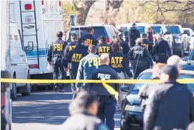  ?? RICARDO B. BRAZZIELL/AUSTIN AMERICAN-STATESMAN ?? Authoritie­s work on the scene after multiple explosions using package bombs in Austin on Monday.