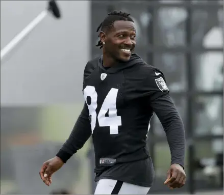  ?? JEFF CHIU - THE ASSOCIATED PRESS ?? ILE - In this Aug. 20, 2019file photo, Oakland Raiders’ Antonio Brown smiles before stretching during NFL football practice in Alameda,