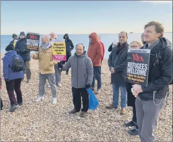  ?? ?? SERVICE Some of the campaigner­s marking the vigil in honour of the 27 refugees who died attempting to cross the Channel