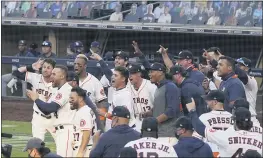  ?? ASHLEY LANDIS — THE ASSOCIATED PRESS ?? Players celebrate Carlos Correa’s walk off home run during the ninth inning in Game 5of the ALCS on Tuesday for Houston.
