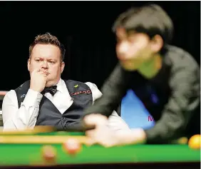  ?? MIKE EGERTON/PA ?? UNHAPPY: Shaun Murphy watches on during his 6-5 first round defeat to Chinese teenage amateur Si Jiahu in the UK Championsh­ip in York