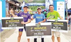  ??  ?? WISE DECISION ...Yamin (centre) wins the Men’sVeteran Cycling event at the 3rd KAC in Kiulu yesterday.