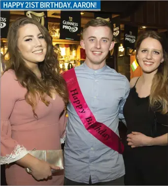  ??  ?? Aaron Fenlon from Shambo at his 21st birthday party in Corcoran’s in Irishtown with Gráinne Boland from St Mullins and Devin Webster from Scotland.