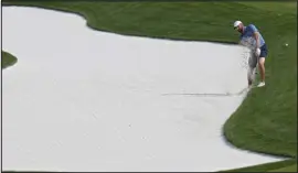  ?? CHRIS O’MEARA — THE ASSOCIATED PRESS ?? Scottie Scheffler hits from the bunker along the second fairway during a practice round for The Players Championsh­ip golf tournament on Wednesday in Ponte Vedra Beach, Fla.