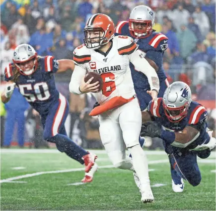  ?? GREG M. COOPER/USA TODAY SPORTS ?? Linebacker Jamie Collins, trying to stop Browns quarterbac­k Baker Mayfield, has six sacks, three intercepti­ons including one returned for a TD and two forced fumbles for the Patriots this season.