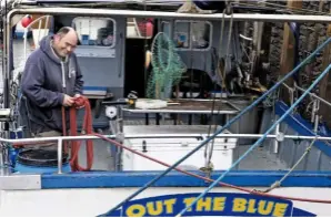  ??  ?? Skipper Terry Morris on deck aboard his passengerc­arrying boat, Out of the Blue.