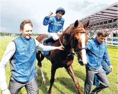  ??  ?? Job done: William Buick celebrates his Coral-Eclipse victory on the talented Hawkbill