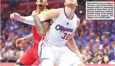  ??  ?? Blake Griffin of the LA Clippers and Trevor Ariza of the Houston Rockets battle for rebounding position in Game Three of the Western Conference semifinal playoffs Friday at the Staples Center in Los Angeles. The Clippers won, 124-99. (AFP)