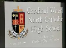  ?? KEITH SRAKOCIC — THE ASSOCIATED PRESS ?? A sign marks the bus entrance to Cardinal Wuerl North Catholic High School, Thursday in Cranberry Township, Pa. The Roman Catholic high school will shed the Cardinal Wuerl name of Washington’s archbishop, who was cited in a sweeping grand jury report as having allowed priests accused of sexually abusing children to be reassigned or reinstated while he was Pittsburgh’s bishop. The sign at the front entrance was vandalized earlier in the week with the Cardinal’s name painted over.