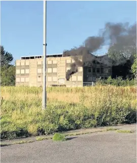  ??  ?? An arson investigat­ion has been launched after a fire at the old college in Skelmersda­le